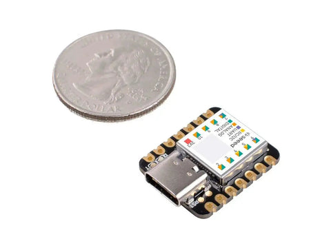 XIAO SAMD21 Microcontroller next to a coin showing size comparison, ideal for Arduino compatible projects and DIY makers.