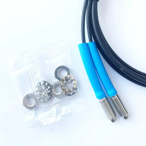 FT610 Diffuse Reflective Optical Fiber Sensor with 1M line, M6 probe, and accessories, shown with rugged TPV housing for industrial use.