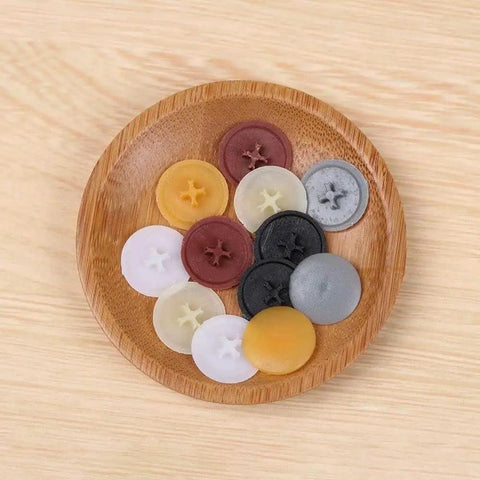 Colorful plastic screw cap covers on a wooden plate