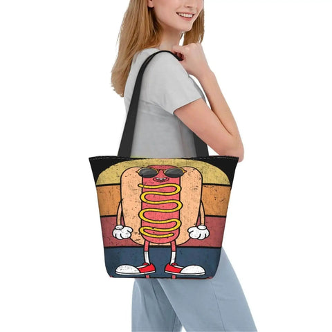 Woman carrying large capacity lightweight tote bag with hotdog design, polyester material, ideal for work, travel, and shopping.
