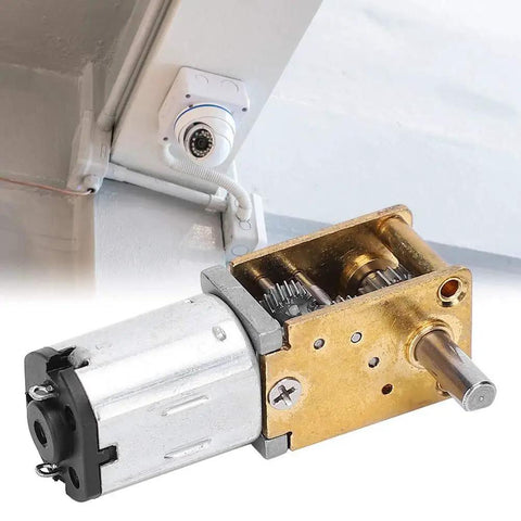 Mini Gear Motor 6V 35 RPM High Torque Brush DC Gear Motor installed near electronic device, showcasing components up close.