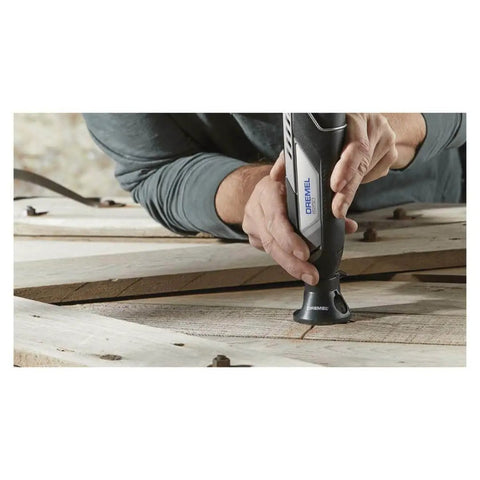 Person using 12V Lithium-Ion Cordless Rotary Tool With Brushless Motor, Variable Speed, 3.0Ah Battery, Includes 5 Accessories, Beast Mode Power, Extended Runtime, Works With All Rotary Accessories, Renewed on wooden surface.