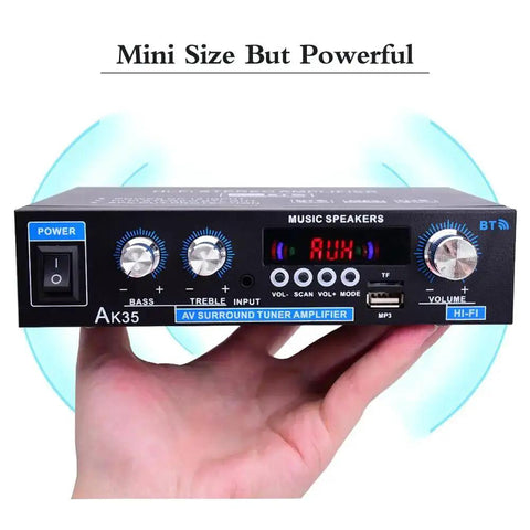 Person holding Mini Stereo Amplifier For Home Audio With Bluetooth Five Point Zero Two Channel 200W Peak Power 30W RMS USB TF Aux Inputs