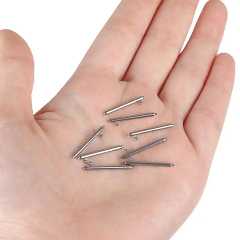 Hand holding Quick Release Watch Spring Bar Pins 20 Piece Set 12Mm 14Mm 16Mm 18Mm 20Mm 22Mm 24Mm Stainless Steel With Watch Strap Repair Tool