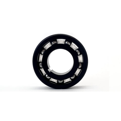 DUODUO AXV055P pool cleaner main turbine bearing, circular black housing with silver ball bearings.