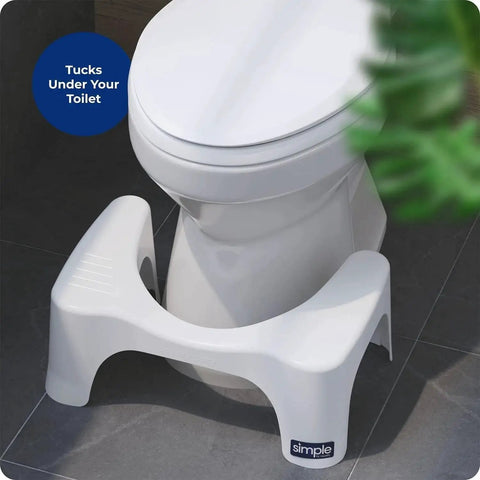 Simple Curve 7 Inch White Bathroom Toilet Stool For Easy Squatting shown under a toilet in a bathroom setting