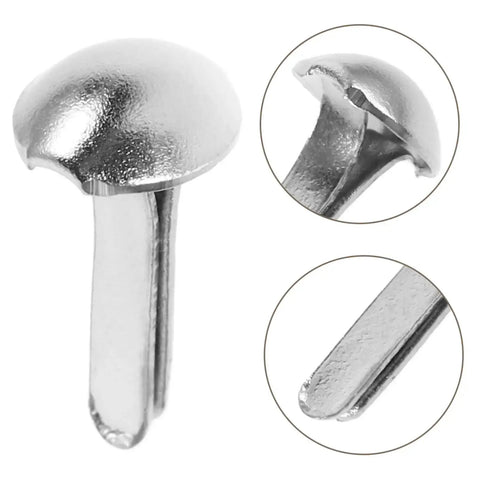Close-up of silver split pins from 100 Piece Doll Joints Puppet Craft Kit For Kids And Grownups Scrapbook Fasteners