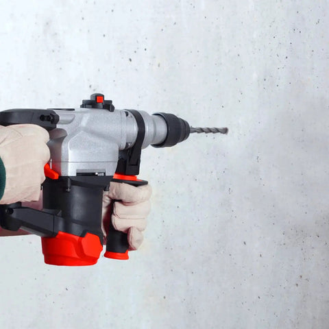 Person using Three Sixteenth Inch SDS Plus Concrete Drill Bits Set For Hammer Drills on concrete wall, close-up view