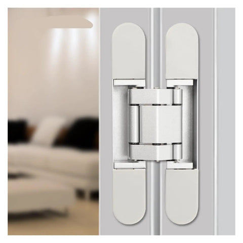 Close-up of a hidden cross-style hinge installed on a wood door, showing the hinge mechanism and silver finish.