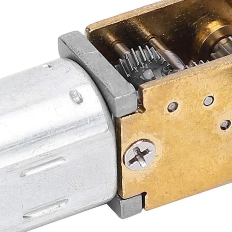 Close-up of Mini Gear Motor 6V 35 RPM High Torque Brush DC Gear Motor showing internal gears and metal casing.
