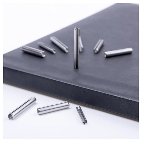 120 Piece Spring Pin Kit In 5 Sizes 304 Stainless Steel Slotted Roll Pins GB879 scattered on black surface