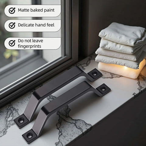 Two 6.1 Inch Matte Black Sliding Barn Door Handle Pulls on marble surface, heavy-duty zinc alloy, for cabinet or closet, rustproof.