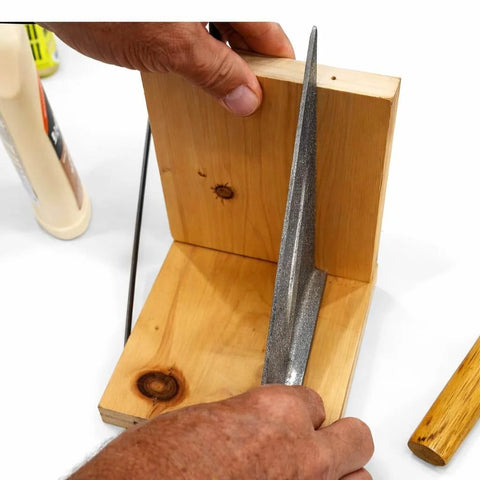 Person holding wooden boards with Pro Grade Fluted Birch Wood Dowel Pins 3/8 x 1-1/2 Inch for joinery.