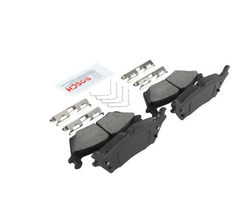 Front view: Bosch BE2383H rear ceramic brake pad set with hardware; includes two pads and mounting clips