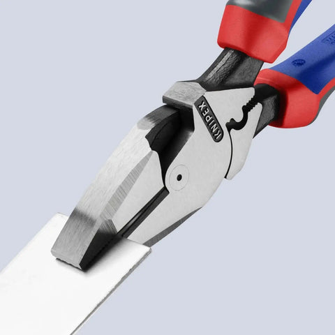 Close-up of Ultra High Leverage Linemans Pliers with Fish Tape Puller and Crimper 9.5 Inch Pro Grade Comfort Grips cutting material