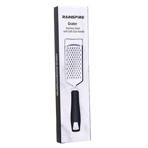 Box of Stainless Steel Handheld Cheese Grater With Soft Grip Handle And Zester, visible product image, kitchen tool for grating.
