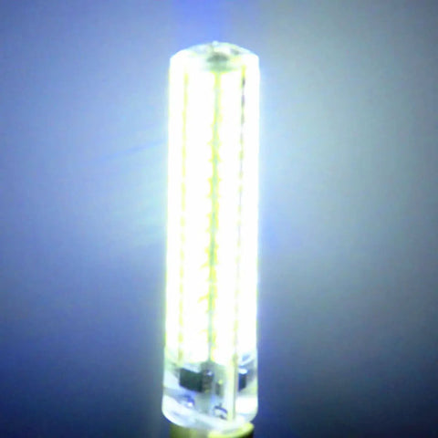 Close-up of a glowing LED bulb against a dark background, showcasing its bright light and cylindrical shape.