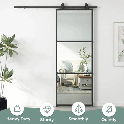 Clear Tempered Glass Barn Door 28 Inch By 84 Inch With Carbon Steel Frame Pre Drilled For Easy Assembly Including 5 Foot Hardware Kit And Soft Close System For Smooth Sliding And Modern Interior Spaces installed in living room