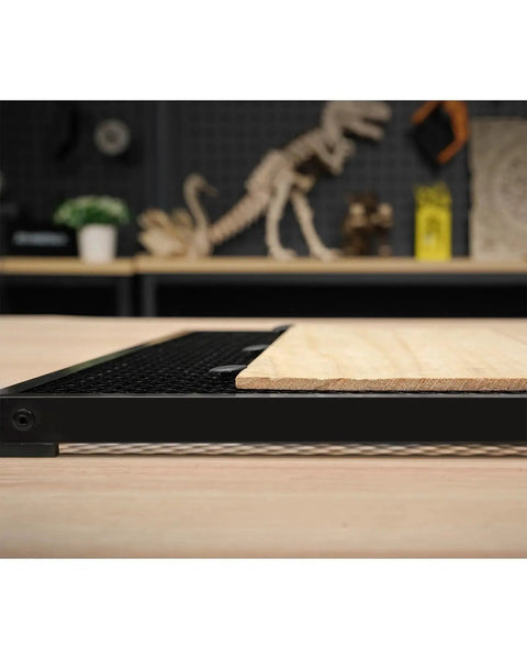 Side view of Honeycomb Laser Bed For ATOMSTACK F2N 350x350mm Work Table With Beefed Up Heat Dissipation in black on a table.
