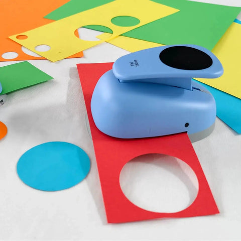 Blue XL 3 Inch Circle Punch for Paper Crafts and Scrapbooking with spring action lever shown cutting colored cardstock circles