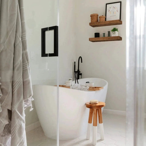 Rustic Farmhouse Bathroom Floating Shelves Over Toilet Set Of 2 above tub, 15.7 inch wide MDF shelves with towels and decor items.