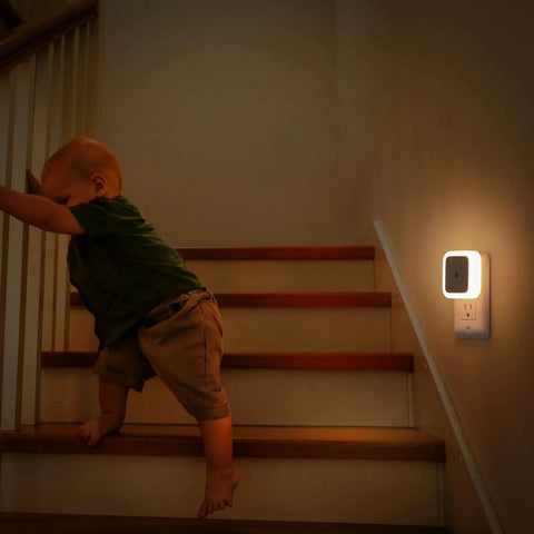 8 Pack Dusk To Dawn Wall Plug Night Lights 3000K Warm White LED installed in staircase showing baby climbing stairs