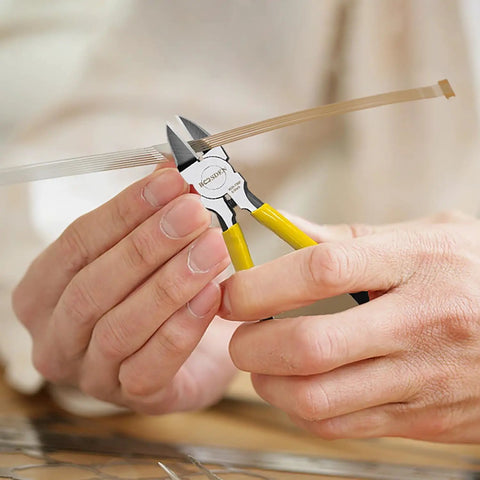 Close-up of hands using Ultra Sharp 6.5 Inch Wire Cutter For Jewelry Making And Crafting to cut thin wire.