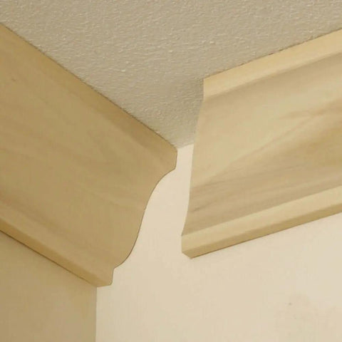 Installed crown molding pieces with clean cope cuts using Speed Cope Crown Molding Jig With Adjustable Handle For DIY Woodworking.