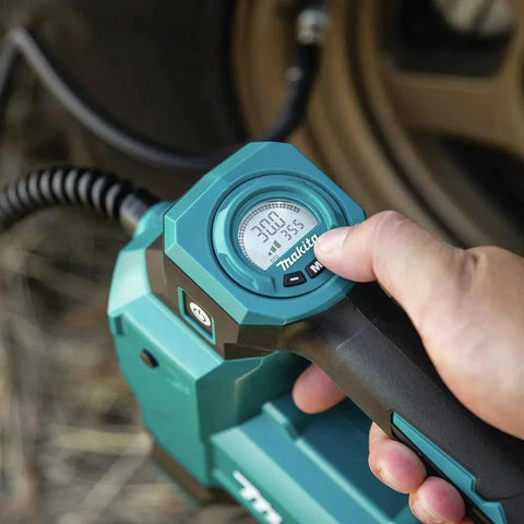 Close-up of Cordless 18V High Pressure Inflator With Auto Stop Tool Only 160 PSI Fast Inflation For Cars Trucks Bikes And Sports Balls LXT Battery Not Included DMP181ZX showing LED gauge in use