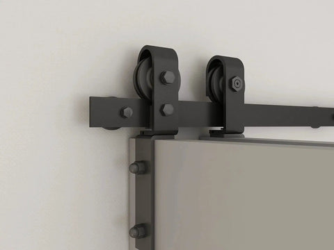 Sliding hardware kit for Unfinished 30 Inch By 84 Inch Wood Bi Fold Barn Door DIY Install, showing rollers and track on a wall.