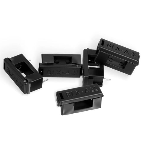 30 Pack 5 X 20 mm PCB Fuse Holder Kit Black Plastic Mount With Cover scattered in a pile for circuit protection and repairs
