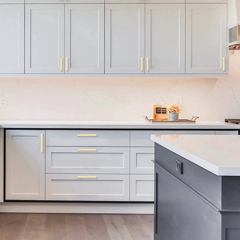 Grey kitchen cabinets with Brushed Gold Cabinet Pulls Pack Of 10, 5 Inch Hole Centers, Zinc Alloy And Brass Construction installed