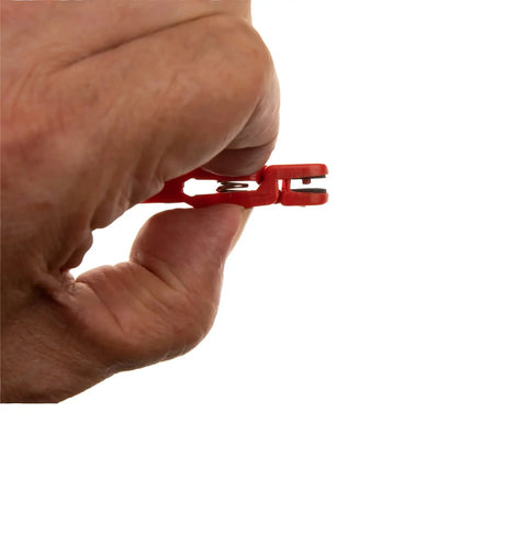 Hand holding red snap release clip, side view, part of Heavy Tension Snap Release Clips For Downriggers, Outriggers And Planer Boards Red 10 Pcs ABS Plastic