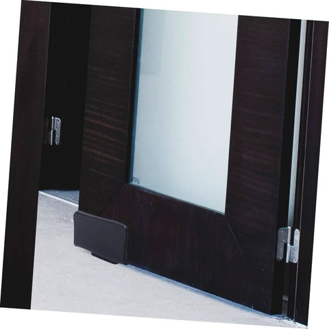 Barn Door Track Stop Floor Guide Ground Mount Adjustable Black Carbon Steel Hardware Kit For Sliding Doors Works On Pre Grooved Or Non Grooved Doors Easy To Install DIY Barn Door Accessory shown installed on a barn door.