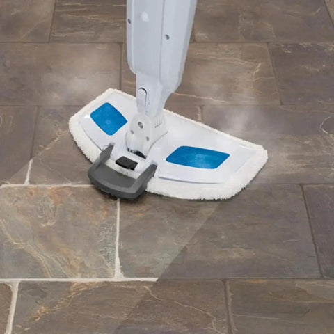 Front view of BonusLife steam mop pad attached to Bissell PowerFresh mop head; white pad with blue patches.