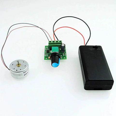 Low Voltage PWM DC Motor Speed Controller 1.8V To 12V 2A 24W Adjustable Driver Switch displayed with DC motor and battery holder