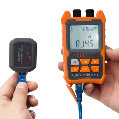 Orange handheld optical multimeter with LCD display connected to a blue fiber patch cable and a black tester module.