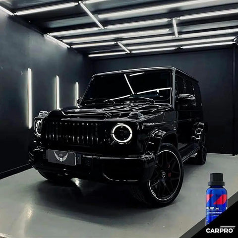 Car in garage with CQUARTZ UK 3.0 Ceramic Coating Kit For Cars Bonds To Paint Glass Metal on the floor