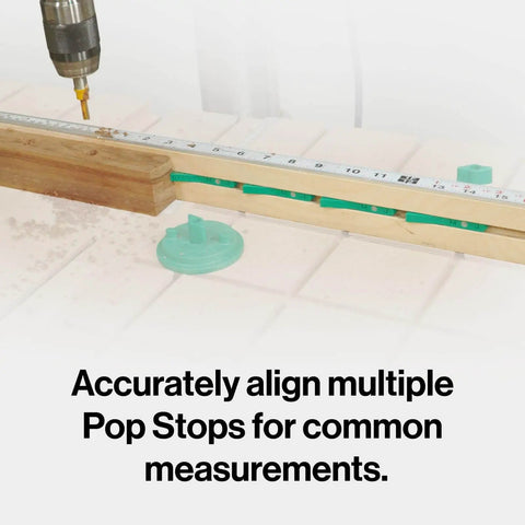 MicroJig MatchFit Pop Stop 6-Pack installed on dovetail track for accurate woodworking measurements, showing low-profile design.