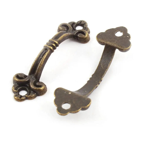 10 Pack Antique Brass Zinc Alloy Mini Jewelry Box Drawer Cabinet Knob Pull Handle For Small Chests And Cabinets With 38mm Hole Spacing And 48mm Diameter Includes Mounting Screws Vintage Look Hardware For Furniture Restoration And Craft Projects, showing two decorative handles on white background.