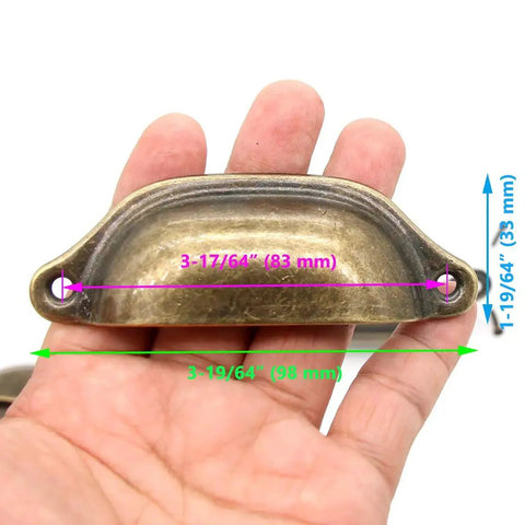 Vintage Seashell Shaped Cup Pulls Set In Antique Bronze Finish For Cabinets And Drawers, 8 Pack Iron Hardware held in hand.