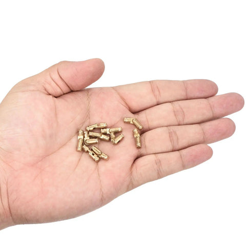 Hand holding Invisible Brass Barrel Hinges 12 Pack Concealed 15x4mm for DIY keepsake boxes, cabinets, copper material