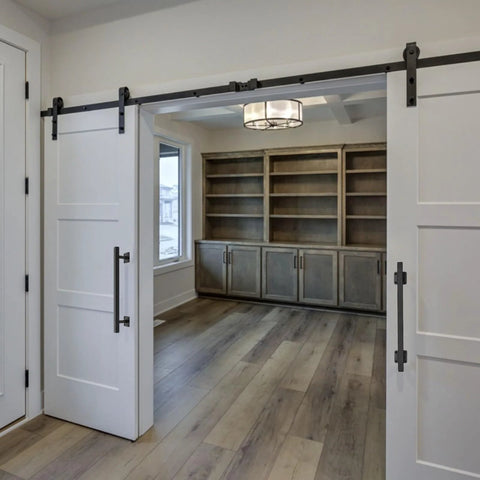 Interior view of 16 Inch Square Sliding Barn Door Handles Set Of 2 Black Matte Iron Gate Pulls installed on white barn doors.