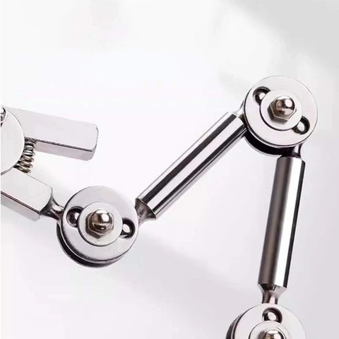 Close-up of Universal Welding Fixture With Clamp Rebound Jig and Third Hand Soldering Station joints, metal components visible.
