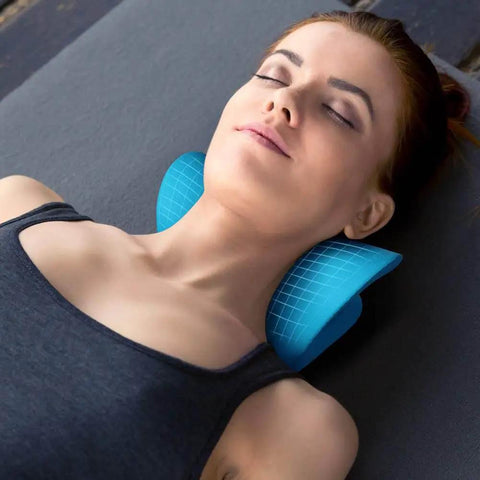 Woman using Neck And Shoulder Relaxer Cervical Traction Device For TMJ Pain Relief And Cervical Spine Alignment, Blue