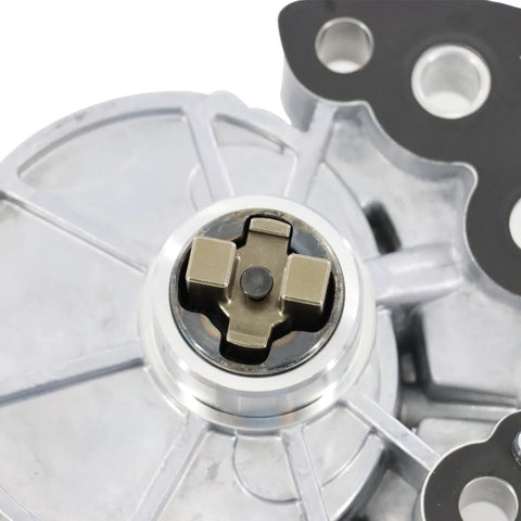Brake vacuum pump impeller inside silver housing with brass cross-shaped hub