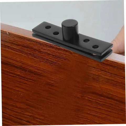 Close-up of 2-Piece Stainless Steel Hidden Pivot Hinges for Concealed Doors on wooden frame, showcasing sleek black finish.