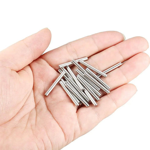 Close-up of a hand holding a 304 Stainless Steel Dowel Pin Set, 3mm X 25mm, 20 Pieces, Rust Resistant Wood Dowels For Furniture And Shelves