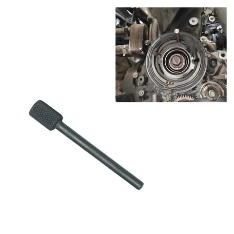 Black DPL camshaft timing tool with knurled end; shown beside engine timing pulley (installed view)