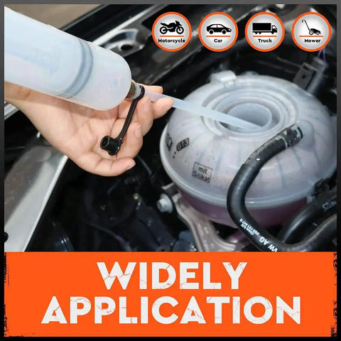 Hand using 500cc Fluid Extractor for Automotive Use With Dual 7 Inch Hoses Vacuum Syringe on car engine fluid reservoir.